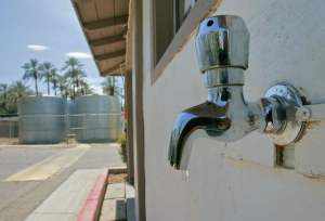sunbird jay calderon the desert sun credit water faucet attached to manager's office at Sunbird so residents will have choice of water source