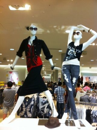 mannequins in busy mall retail store