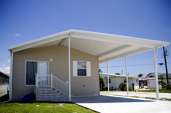 FloridaManufacturedHome-withCarport-credit-83degreesmeda-posted-CuttingEdge_ManufacturedHousing-MHProNews-com-