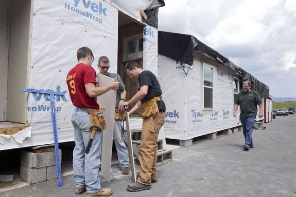 giles county students john teats  austin jennings andrew bales with techer paul baker and modular home