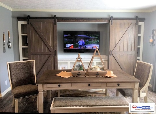 FlatscreenTVBehindBarnDoorsTunicaManufacturedHousingShow2018DiningArea550